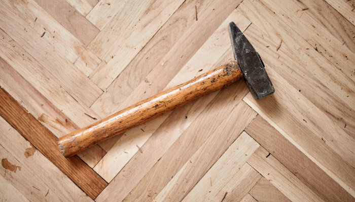 Restoring and cleaning old hardwood floor parquet.